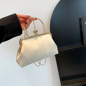 Elegant ivory pleated evening clutch bag with gold frame and round handle