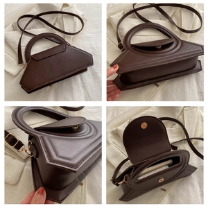 Detail view of deep brown vintage crossbody bag with geometric design and removable strap
