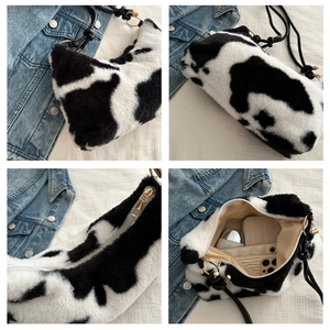 Detail shots of plush cow print underarm bag showing interior capacity and golden hardware