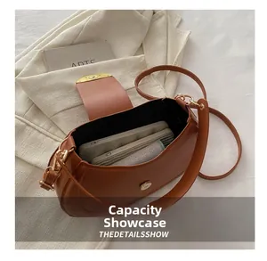 Internal capacity of the brown leather saddle bag showing phone and wallet storage