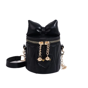 Black bucket bag with bow detail, heart quilting and golden chain strap for women