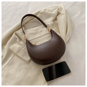 Top view of deep brown crescent shoulder bag with smooth PU leather and gold hardware