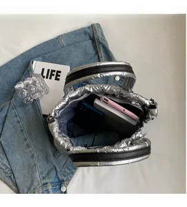 Spacious interior of silver quilted tote bag showing large capacity for essentials
