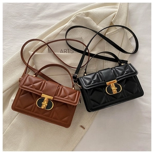Detailed view of quilted PU leather mini bags with elegant gold T-shaped twist lock