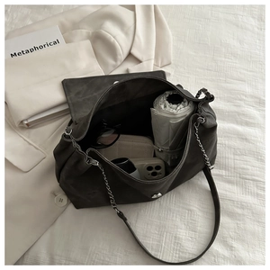 Deep gray matte chain bag showing spacious interior with umbrella and wallet