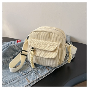 Simple cream corduroy shoulder bag with textured stripe and adjustable strap for women