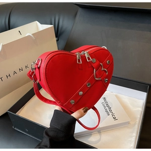 Fashionable red heart shaped crossbody bag with silver hardware in a gift box