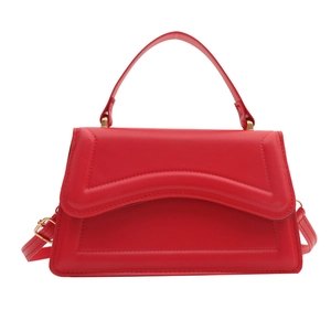Chic red trapezoid crossbody bag for women with wavy stitching and gold hardware