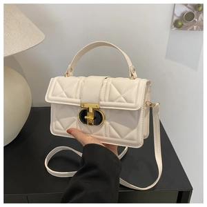 Quilted off-white PU leather crossbody bag with golden metal twist lock and top handle