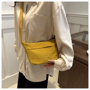 Ginger yellow nylon crescent crossbody bag for women in minimalist casual daily style