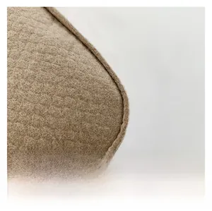 Detailed macro view of the premium light brown felt texture and neat edge stitching