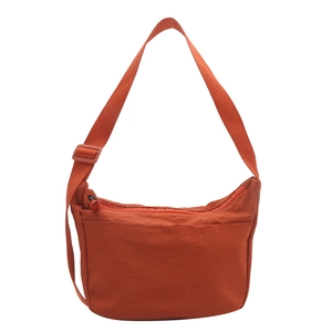 Caramel orange large nylon crescent tote bag with wide adjustable shoulder strap
