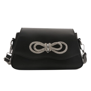Elegant black shoulder bag with a large sparkling rhinestone bow on matte leather