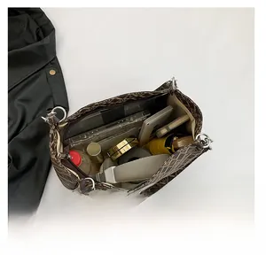 Interior view showing large capacity for essentials in retro brown monogram tote bag