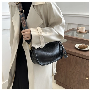 Vintage black oil wax leather crescent crossbody bag with ethnic jacquard wide strap