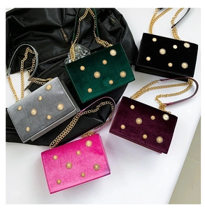 Velvet crossbody bags in five colors with vintage sun flower rivets and chain straps