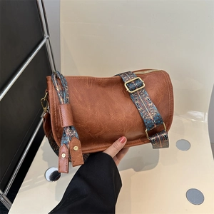 Vintage dark brown Boston cylinder crossbody bag with wide ethnic pattern strap