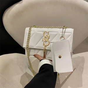 White quilted crossbody bag with gold hardware, metal chain strap and small coin purse