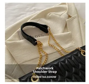 Detail of the black quilted shoulder bag with a mixed gold chain and leather strap design