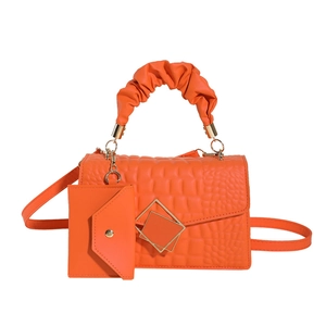 Bright orange crocodile texture crossbody bag with scrunchie handle and mini pouch set