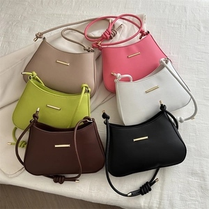 Minimalist shoulder bag set with gold trim and twisted knot straps in six stylish colors