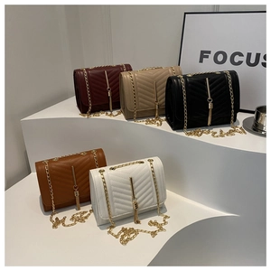 Detailed display of five colorful V-quilted crossbody bags with gold tassel charms