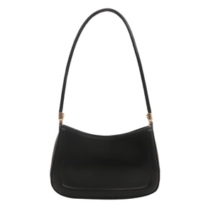 Minimalist black leather underarm bag with sleek curved design and gold hardware
