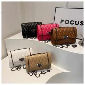 Close-up of quilted PU leather shoulder bags with elegant chain straps in five colors