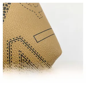 Macro detail of brown lychee grain leather with black leopard spots and geometric patterns