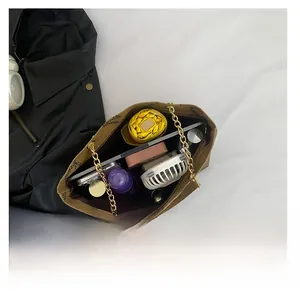Interior view of large capacity brown monogram tote bag showing spacious storage space