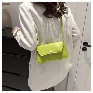 Fluorescent green patent leather underarm bag with gold buckle and curved base