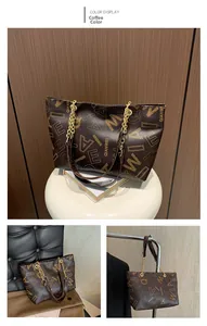 Close-up of brown tote bag featuring gold chain strap and large capacity design