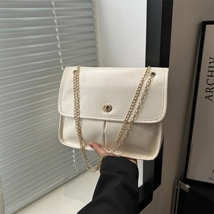 Retro cream white leather shoulder bag with gold chain strap and circular twist lock