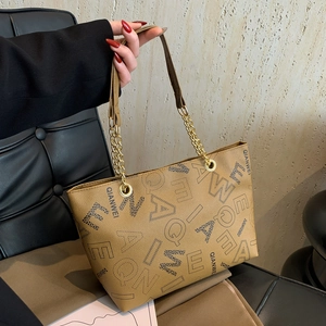 Chic camel faux leather tote bag with gold chain strap and stylish letter print