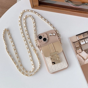 Detail of crossbody phone case with leather chain strap and diamond bow buckle wallet