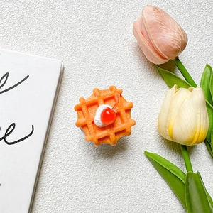 Top view of creative cherry cream waffle phone grip with colorful tulip decor