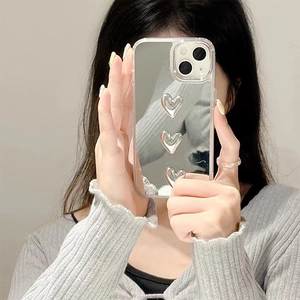 Mirror phone case for iPhone with three 3D silver hearts on a transparent backplate