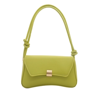 Green leather underarm bag with curved base and golden buckle in studio shot