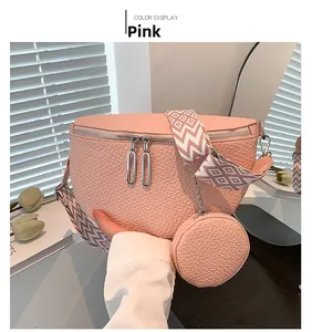Pink saddle bag with patterned wide strap and small round coin purse attachment