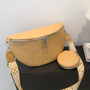 Ginger yellow leather saddle bag with patterned wide strap and mini round pouch