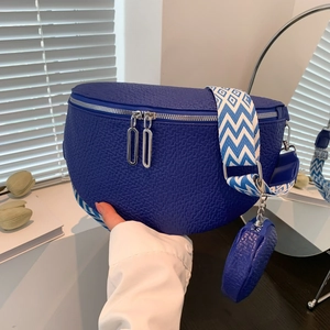 Royal blue saddle crossbody bag with wide geometric strap and small round coin purse