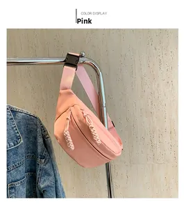 Detailed view of the pink nylon chest bag with waterproof fabric and adjustable strap