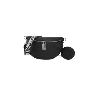 Minimalist black saddle bag with litchi texture and geometric patterned strap