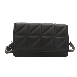 Black geometric embossed crossbody bag with adjustable silver buckle strap on white background