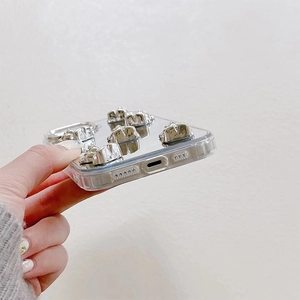 Detailed side view of iPhone case with mirror back and 3D silver bear ornaments