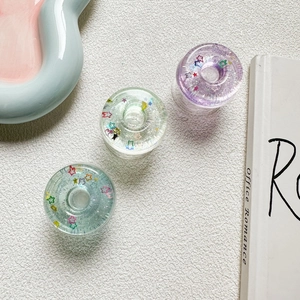 Three-piece set of transparent star sequin phone sockets in pastel blue, green, and purple