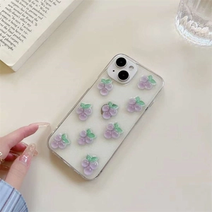 Transparent iPhone case with 3D purple grape charms and glitter on cream background