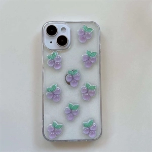 Detail view of 3D resin grape ornaments and glitter finish on a clear iPhone case