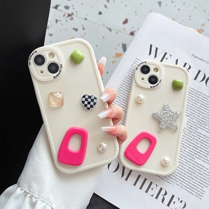 Off-white iPhone case with 3D pearls and star charms in a minimalist stylish handheld view