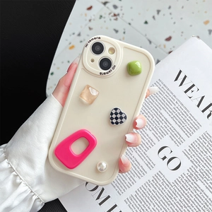 Close-up of cream silicone iPhone case with 3D dopamine heart and pearl charms